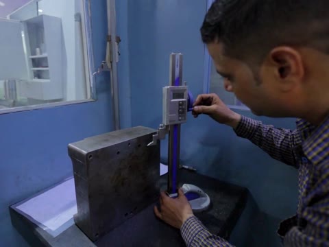 GPI toolmaker checking an injection mould block with a digital height gauge