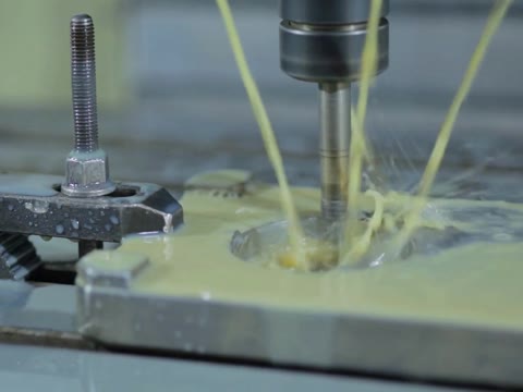 Mould plate being drilled on a CNC machine at General Plastic Industries